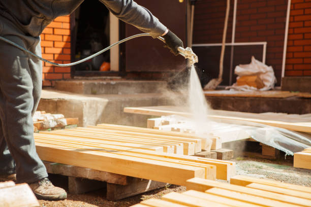 Man is insulating wood framing using Spray Foam Insulation Stamford, CT